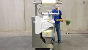 Produce being packaged with a breezy bagger bagging machine